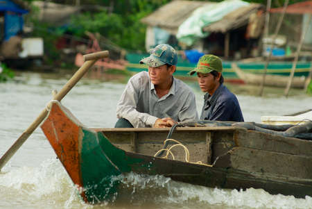 Siem Reap, Cambodia - August 08, 2008: Unidentified people ride on a boat in Siem Reap, Cambodia.のeditorial素材