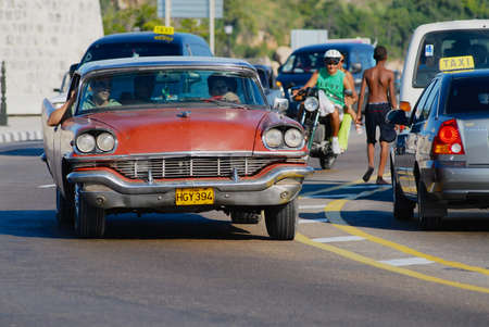 Havana, Cuba - October 21, 2006: Unidentified people drive vintage car in Havana, Cuba.のeditorial素材