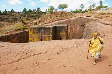 Lalibela, Ethiopia - January 27, 2010: Pilgrim visits unique monolithic rock-hewn Church of St. George (Bete Giyorgis), UNESCO World heritage, in Lalibela, Ethiopia.のeditorial素材