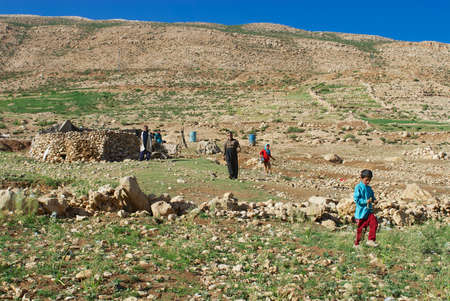 Circa Isfahan, Iran - June 22, 2007: Bakhtiari nomadic people camp circa Isfahan, Iran. Some Bakhtiaris in Iran still follow nomadic lifestyle, live in tents and wear traditional dress daily.のeditorial素材