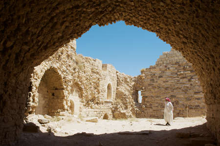Karak, Jordan - August 22, 2012: Tourist visits medieval crusaders castle in Al Karak, Jordan. One...