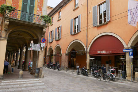 Bologna, Italy - May 10, 2013: View to there street and porticoes at Via Santo Stefano (St. Stephen)...