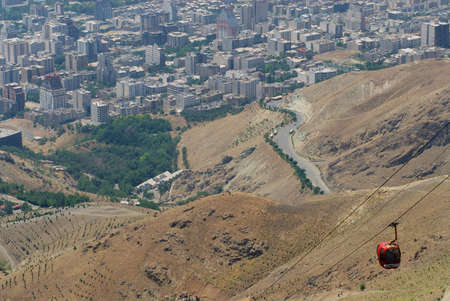 Tehran, Iran - June 15, 2007: Urban landscape of the city with Tochal cable car in Tehran, Iran.のeditorial素材