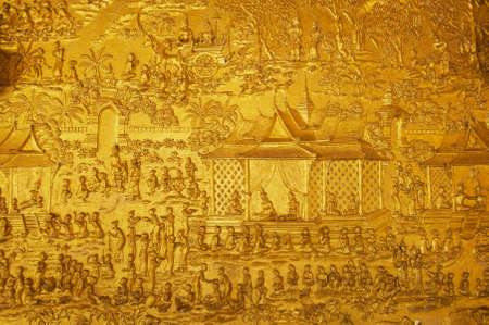 Luang Prabang, Laos - April 16, 2012: Golden exterior wall decoration of the Wat Xieng Thong Buddhist temple in Luang Prabang, Laos.のeditorial素材