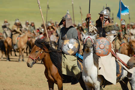 Ulaanbaatar, Mongolia - August 17, 2006: Mongolian horse riders take part in the traditional outdoor historical show of Genghis Khan era in Ulaanbaatar, Mongolia.のeditorial素材