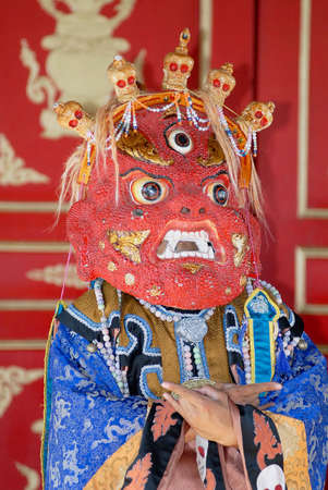 Ulaanbaatar, Mongolia - August 16, 2006: Unidentified person wears traditional shaman's mask and costume in Ulaanbaatar, Mongolia.のeditorial素材