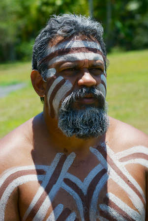 Kuranda, Australia - November 07, 2007: Portrait of aborigine actor with traditional face and body makeup in Tjapukai Culture Park in Kuranda, Queensland, Australia.のeditorial素材