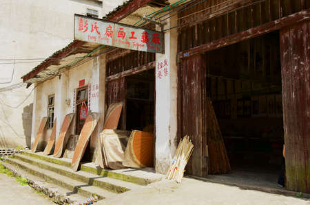 Yangshuo, China - May, 04, 2009: Exterior of a local traditional fans production workshop of Peng family  in Yangshuo, China. Yangshuo is a popular tourist destination in Guangxi region of China.のeditorial素材