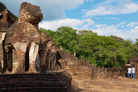 Sukhothai, Thailand - November 18, 2013: People visit ruins of the Si Satchanalai temple in Sukhothai historical Park in Sukhothai, Thailand.のeditorial素材