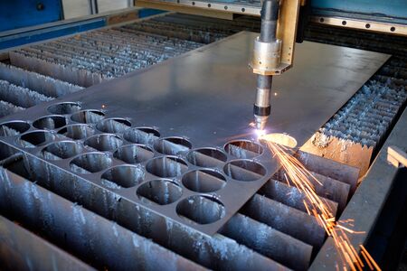 Plasma cutting machine, flame with sparks, metal processing, metalwork industry