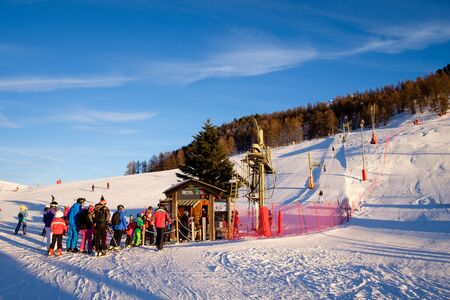Montgenevre ski resort, people waiting in line for the ski lift. Winter holidays in Franceのeditorial素材