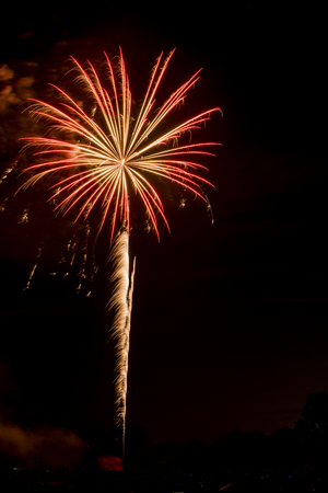 A single firework shot into the air and explodingの写真素材