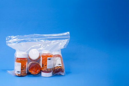 A plastic bag containing multiple RX bottles for a prescription.の写真素材