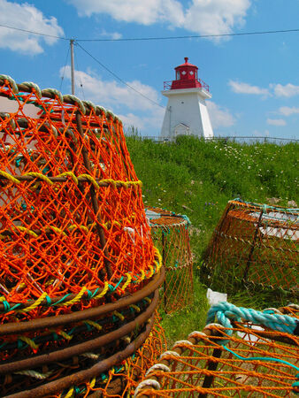 lighthouse and lobster potsの写真素材