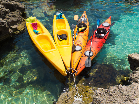 kayaks on clear waterの写真素材