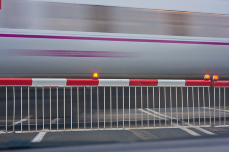train passing level crossingの写真素材