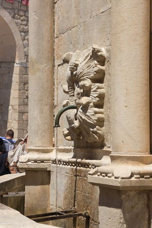 gargoyle fountain in dubrovnikの写真素材
