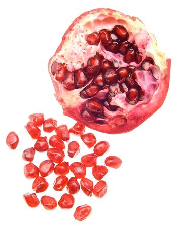 halves of a pomegranate isolated on whiteの写真素材