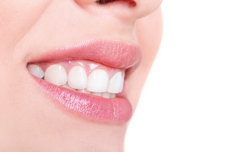 Smile of a beautiful young woman isolated on whiteの写真素材