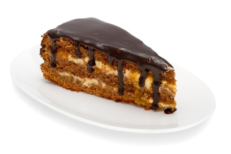 piece of cake with chocolate glaze isolated on whiteの写真素材