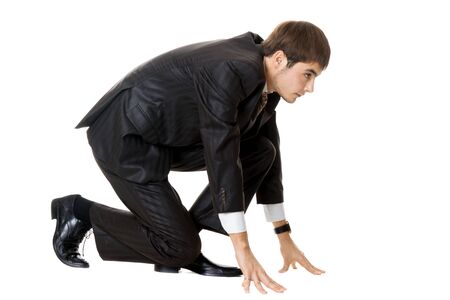 Businessman on starting line isolated over white backgroundの写真素材