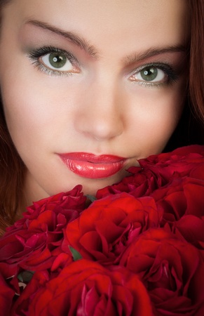 woman with a bouquet of red rosesの写真素材
