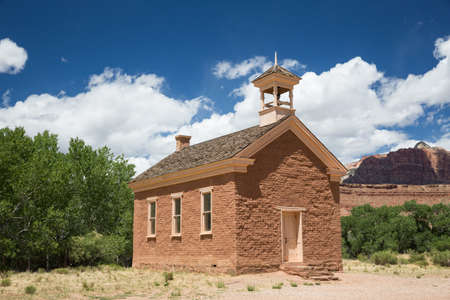 A small community school house leftover from the late 1800's in a small desert community, now an abandoned ghost town.の写真素材