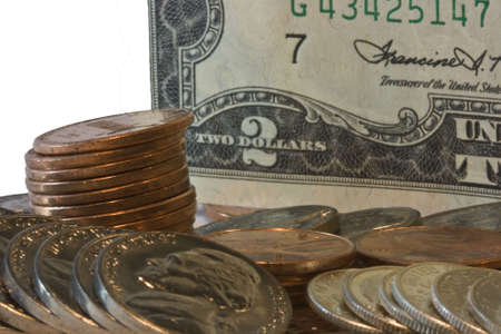 Closeup of two dollar bill with loose change in front