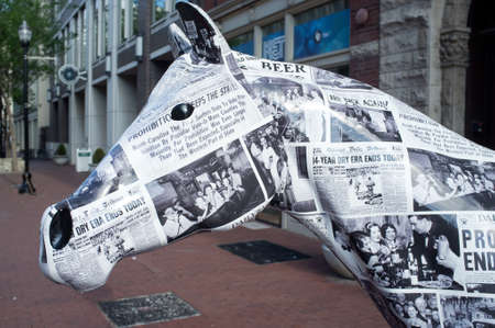 Louisville, KY - May 30: Statue of horse covered with newspapers announcing the end of prohibition on West Main Street, downtown Louisville, Kentucky. Public art celebrates the history of distilling in Kentucky.のeditorial素材