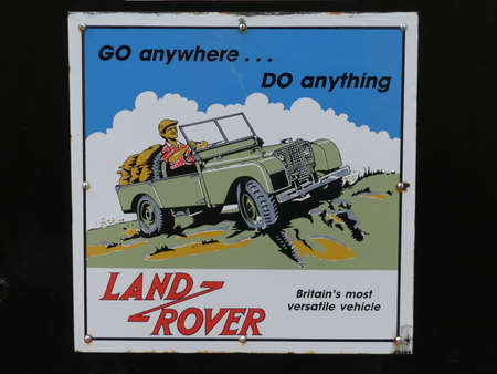Devon, England - August 17 2018. An old metal Land Rover advert, retro, found at an old steam...