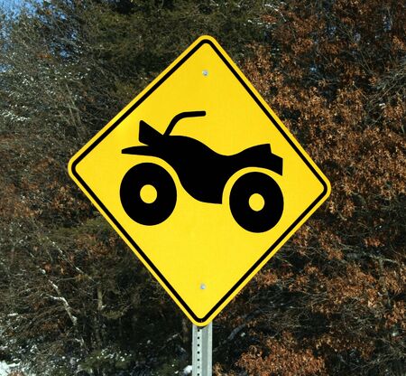 warning sign for four wheeler crossingの写真素材