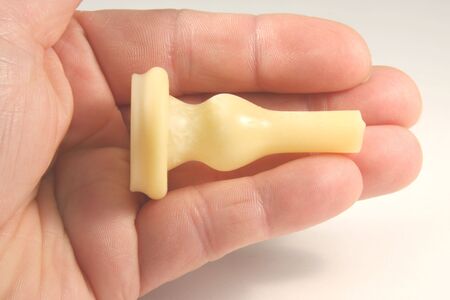 Doctor holds an external condom catheter used for medical treatmentの写真素材