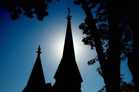 halo behind church at sunriseの写真素材