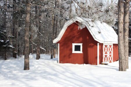 red barn in a winter settingの写真素材