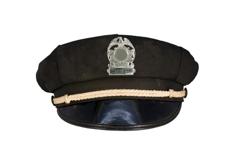 vintage police motorcycle cap with badge isolated over a white background 