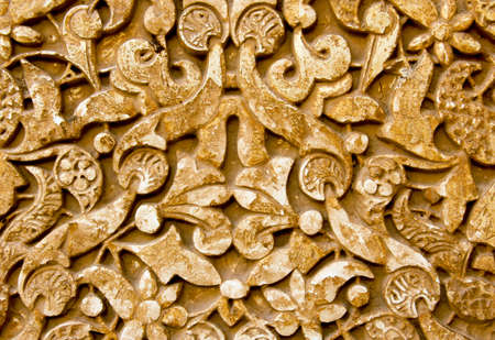 Wall carving from Alhambra Palace in Granada Spain makes a ruins backgroundの写真素材