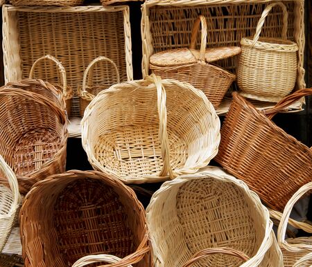 Several stacked baskets make a Wicker Basket Backgroundの写真素材