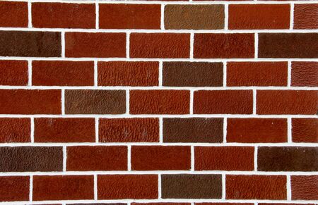 Vintage red brick background with white grout lines