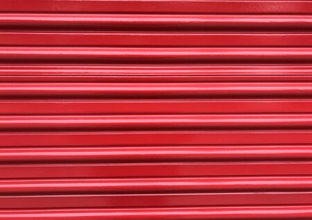 Bright red pleated door makes the backgroundの写真素材
