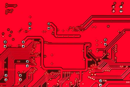 Abstract red printed circuit board texture top viewの写真素材