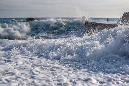 Sea surf at the pierの写真素材