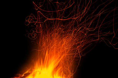 The fire with traces of sparks isolated on blackの写真素材