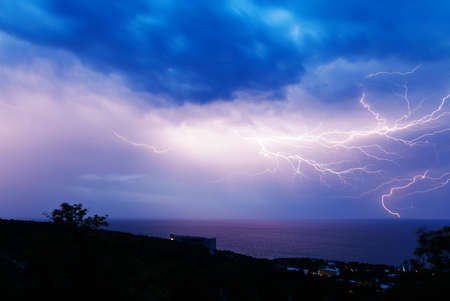 Powerful lightning discharge over the Black sea coast in Crimeaの写真素材