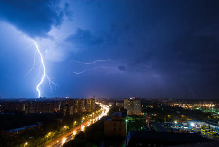 Powerful lightning discharge over the outskirts district of Moscowの写真素材