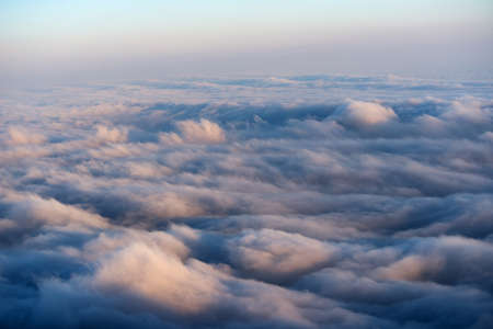 View from the mountains to the dense sea fog at sunset