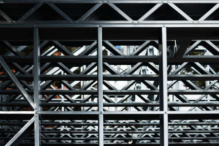 Abstract texture of the metal frame of an unfinished small residential buildingの写真素材
