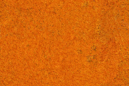 Seamless texture of bright orange rust on metal sheetの写真素材