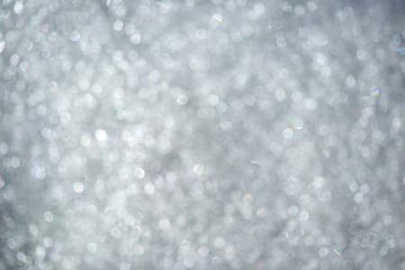 Natural abstract bokeh background of shiny snowの写真素材
