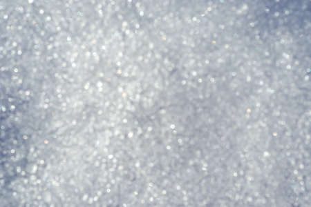 Abstract bokeh texture of shiny snowの写真素材