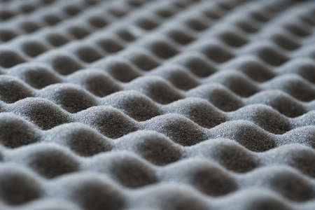 Macrophotography of gray wavy soundproof acoustic foam with selective focusの写真素材